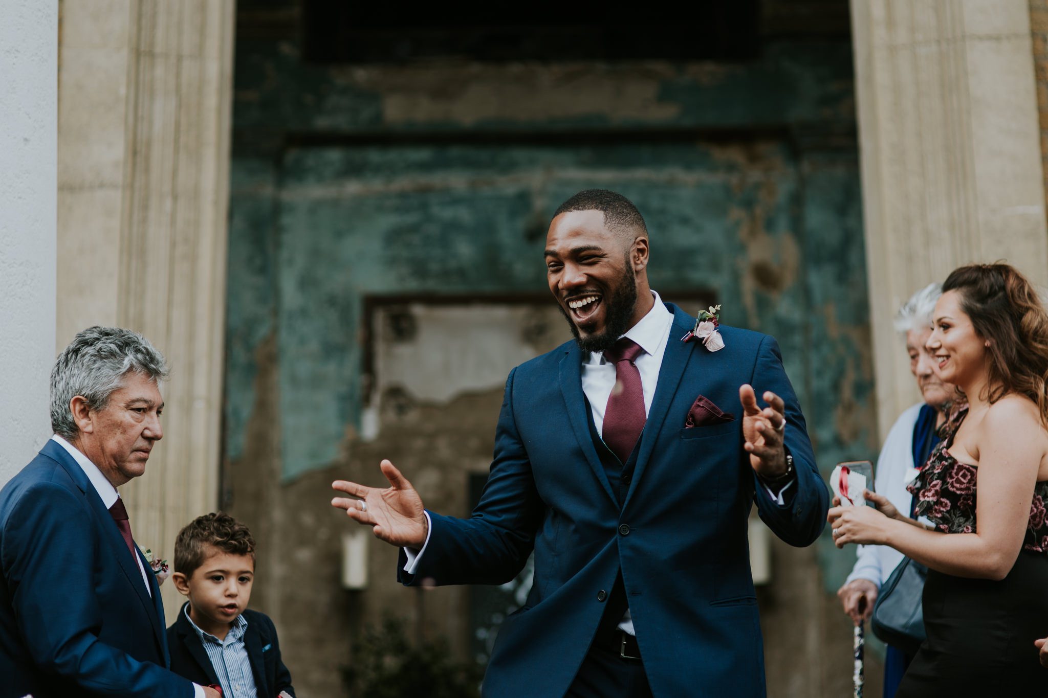 Happy wedding guest at the Asylum Chapel in London