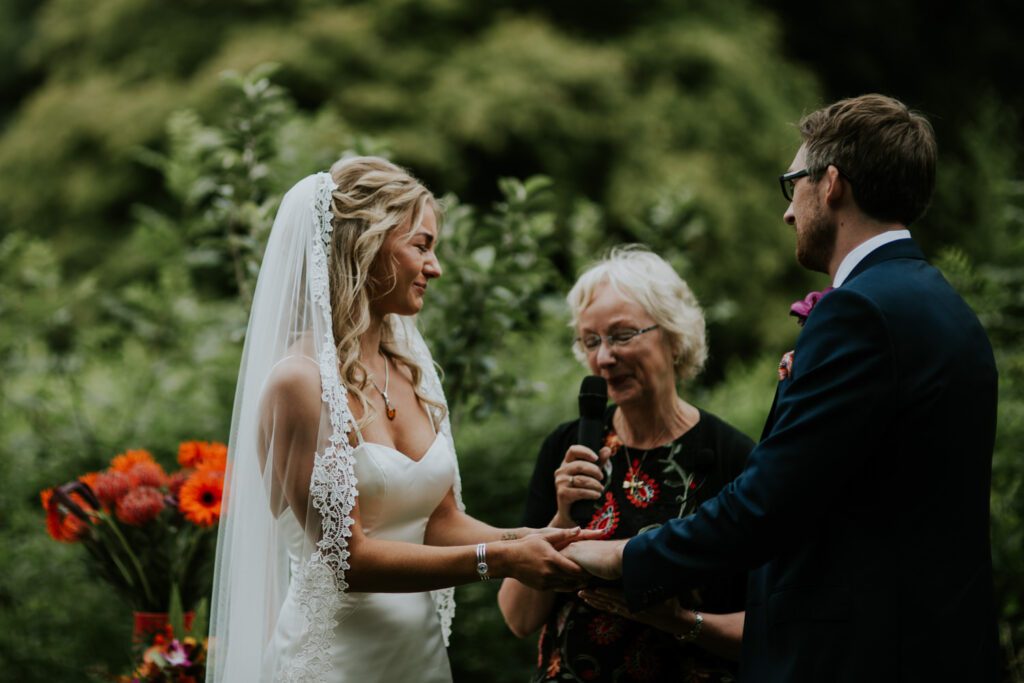 A wedding ceremony in the orchard of Ever After in Devon