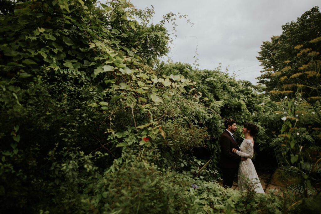 Bride and groom in the gardens at Hayne Devon