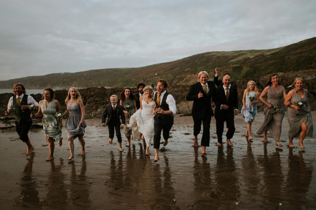The wedding party on the private beach at Polhawn Fort in Cornwall