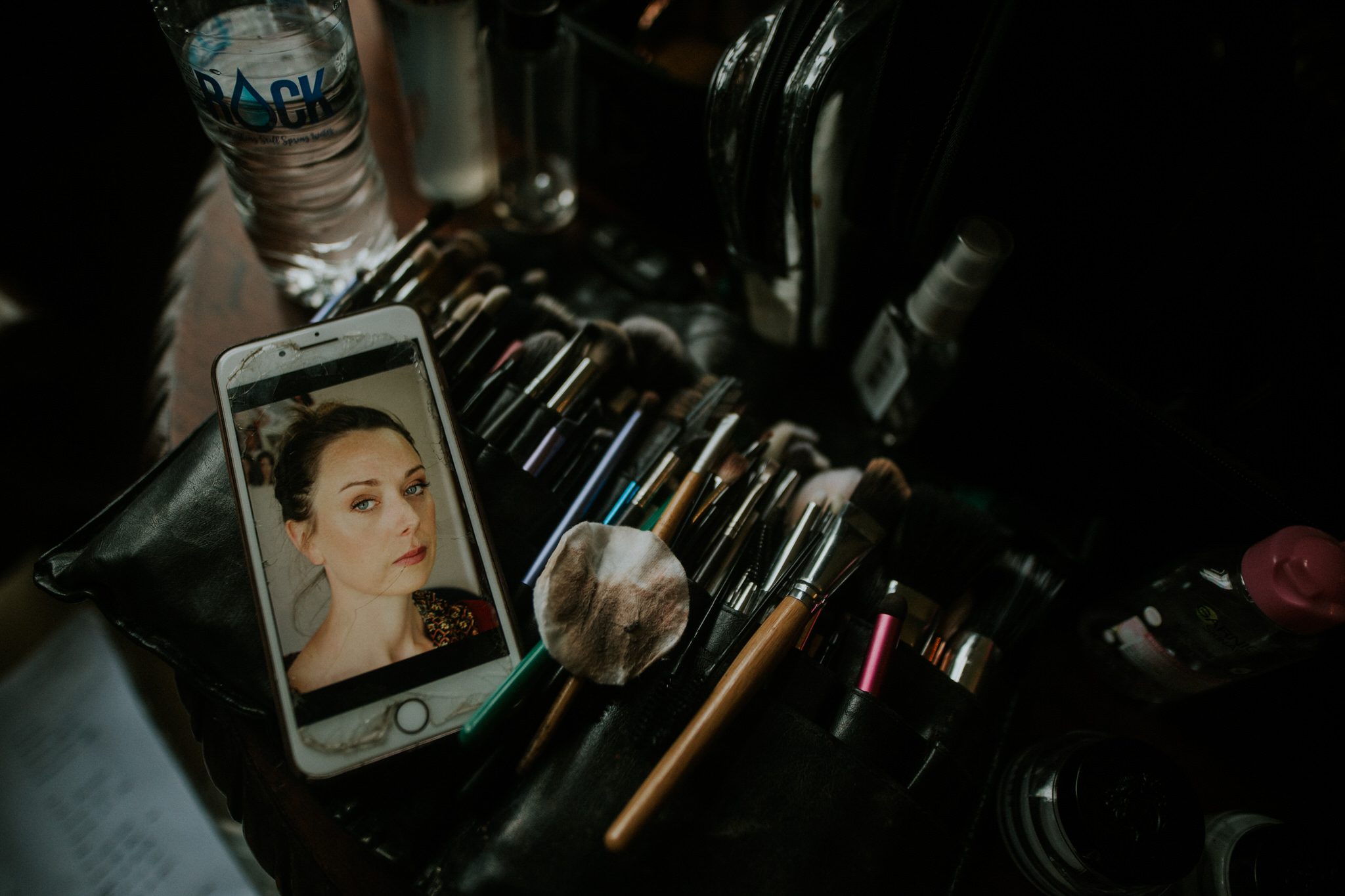 a photograph of a bride and some make up brushes