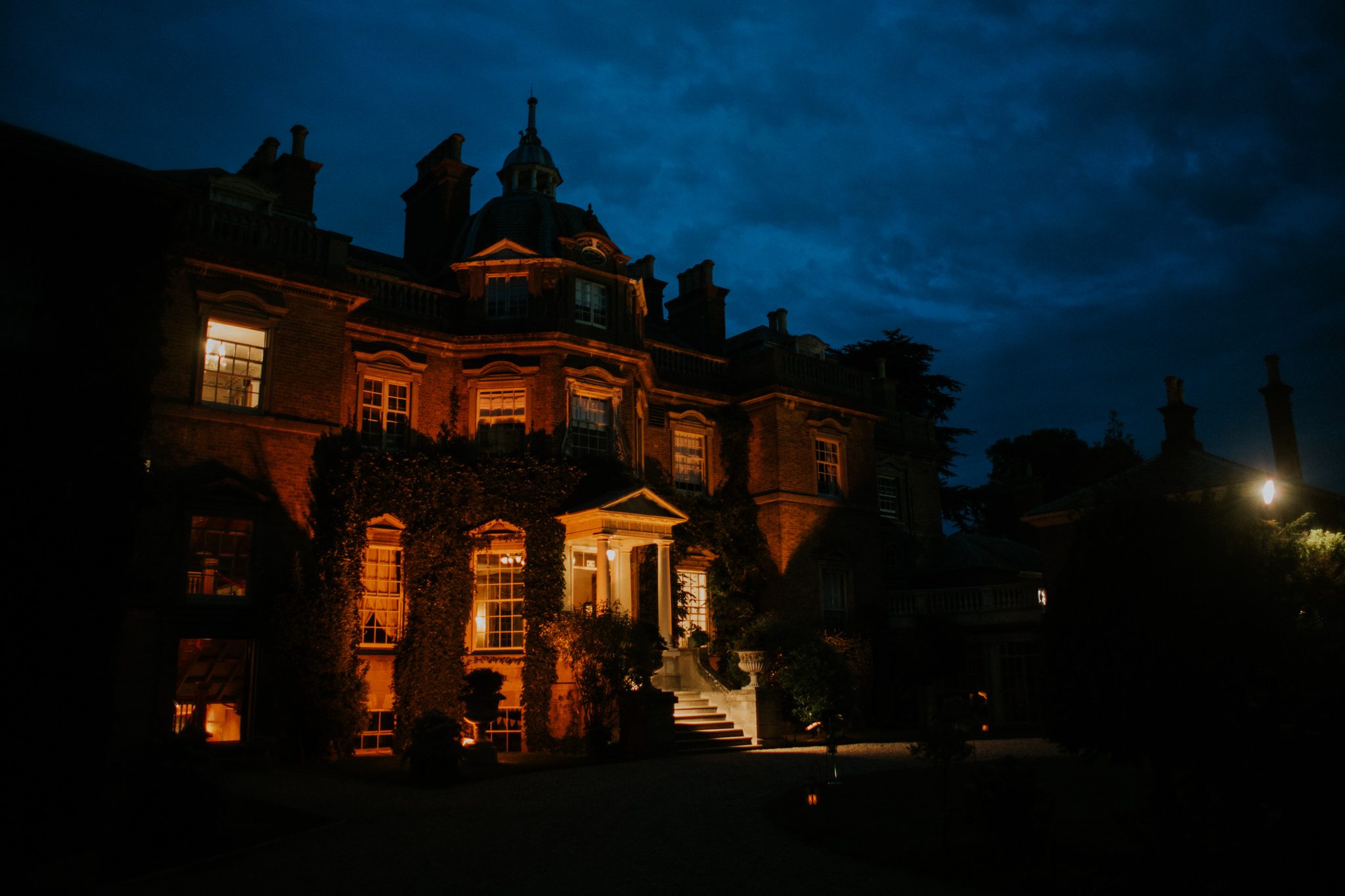 Hampton Court House wedding venue at night