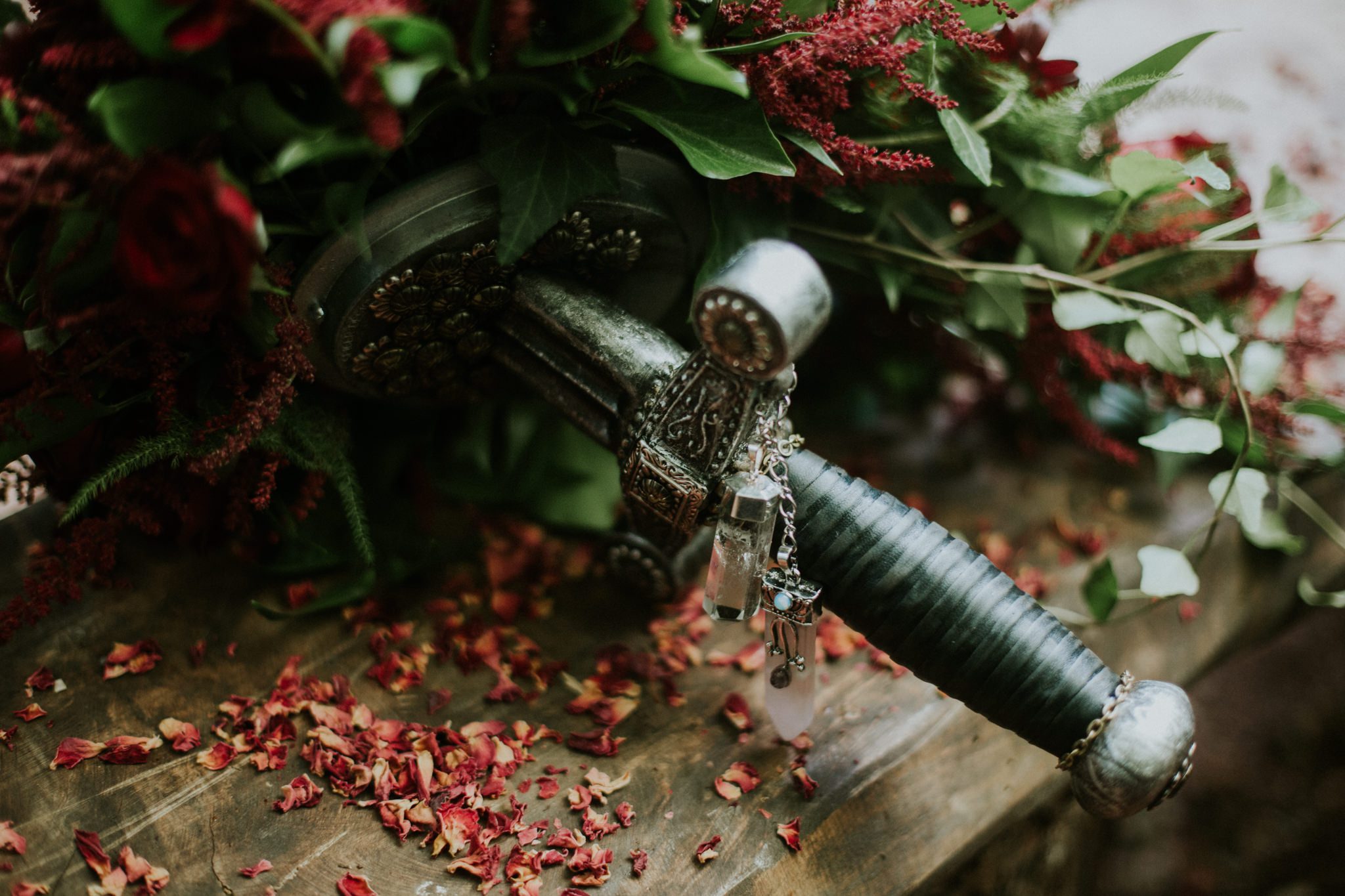 The pommel of a sword is using in a bridal bouquet
