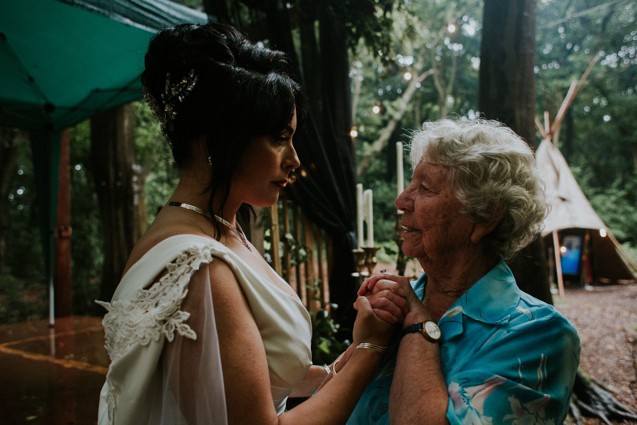 The bride speaks to a guest at her wedding