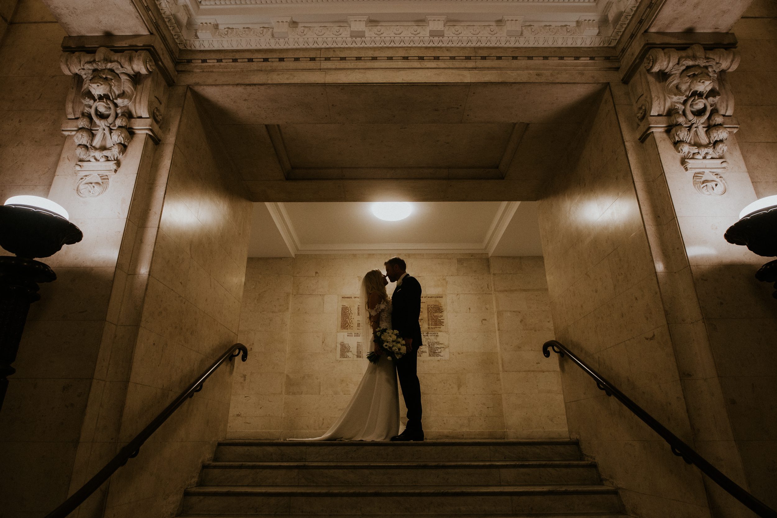 A bride and groom share a quiet moment after their wedding ceremony at Old Marylebone Town Hall, London. Old Marylebone Town Hall wedding photography