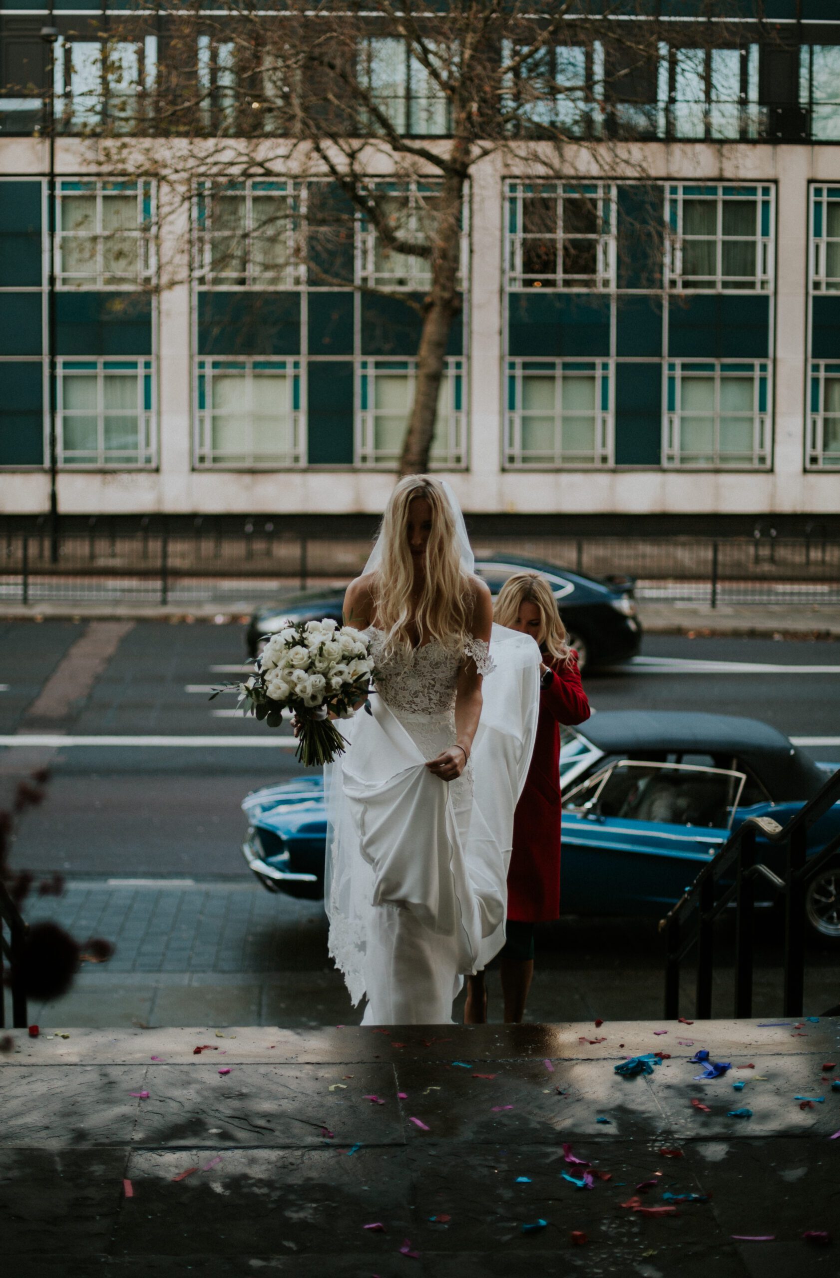 A bride arrives in a vintage car for her wedding ceremony at Old Marylebone Town Hall, London. Old Marylebone Town Hall wedding photography