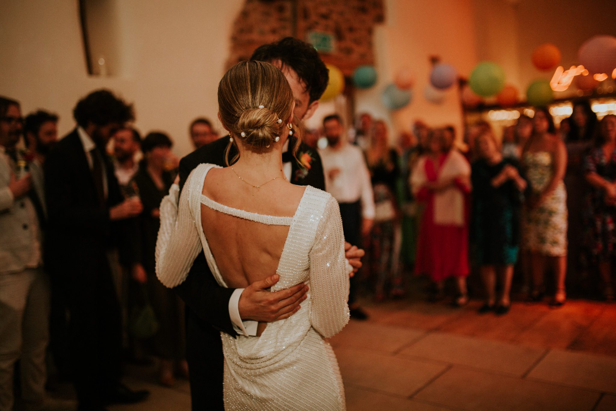 A bride and groom enjoy their first dance as a married couple at their wedding at Hayne Devon