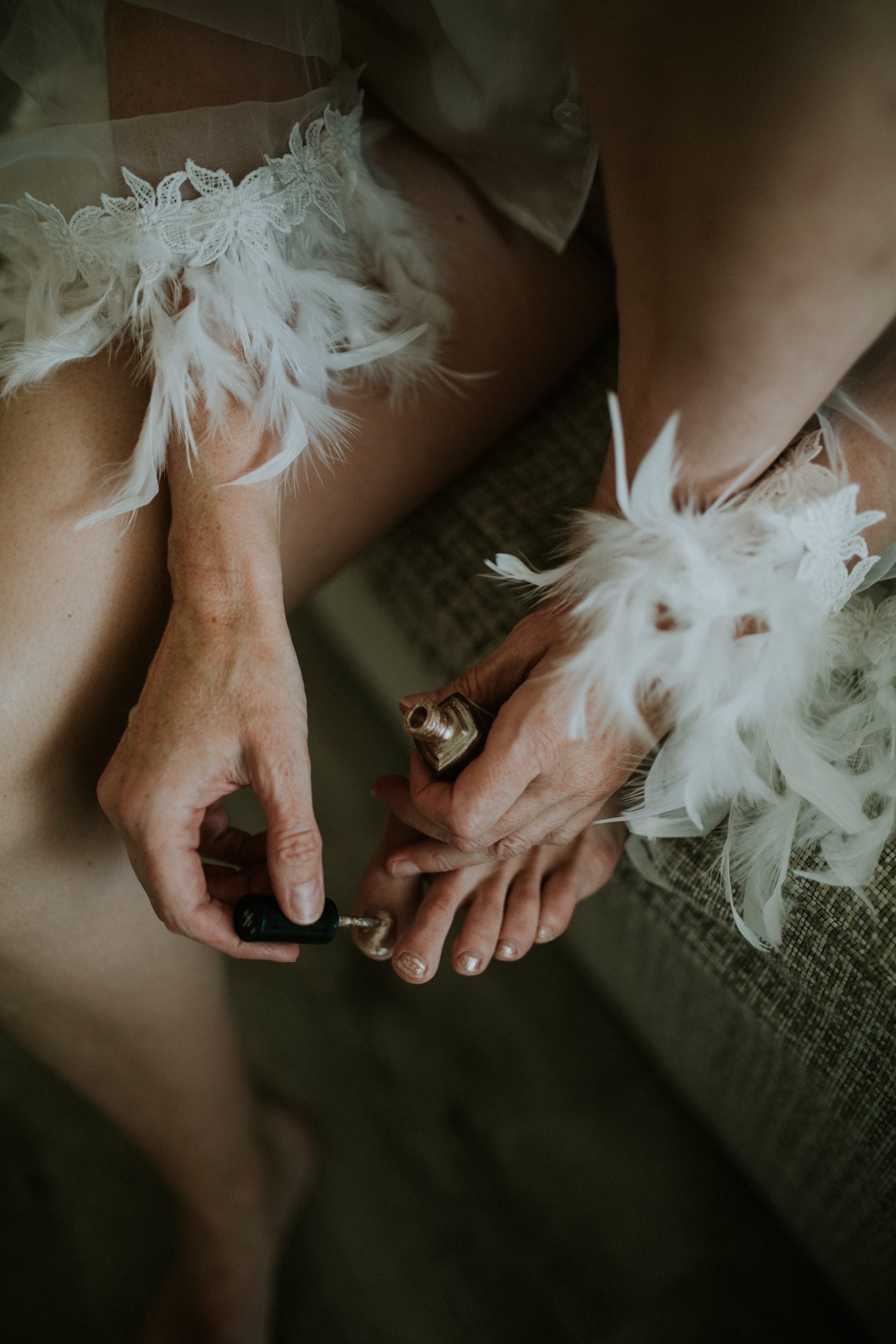 A bride paints her nails before her wedding on the Athenian Coast in Greece