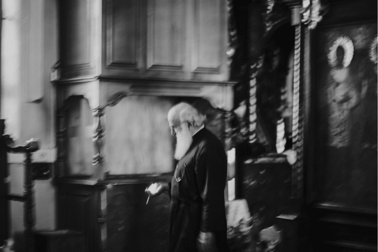 A priest readies the church before a wedding on the Greek island of Skiathos