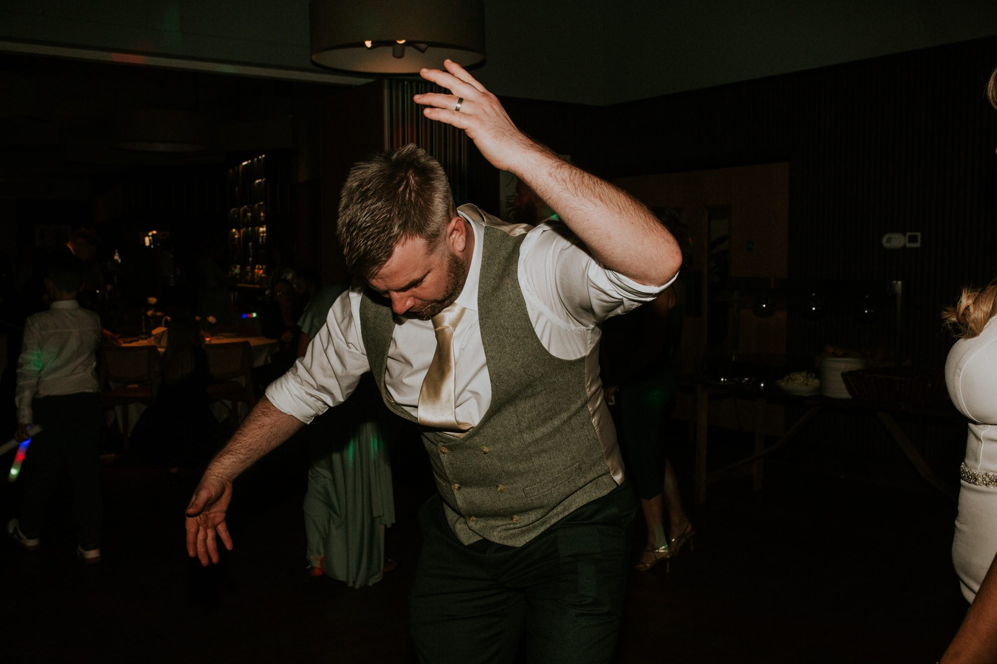 A groom dances onto the dance floor at his wedding at Above the Bay in Falmouth