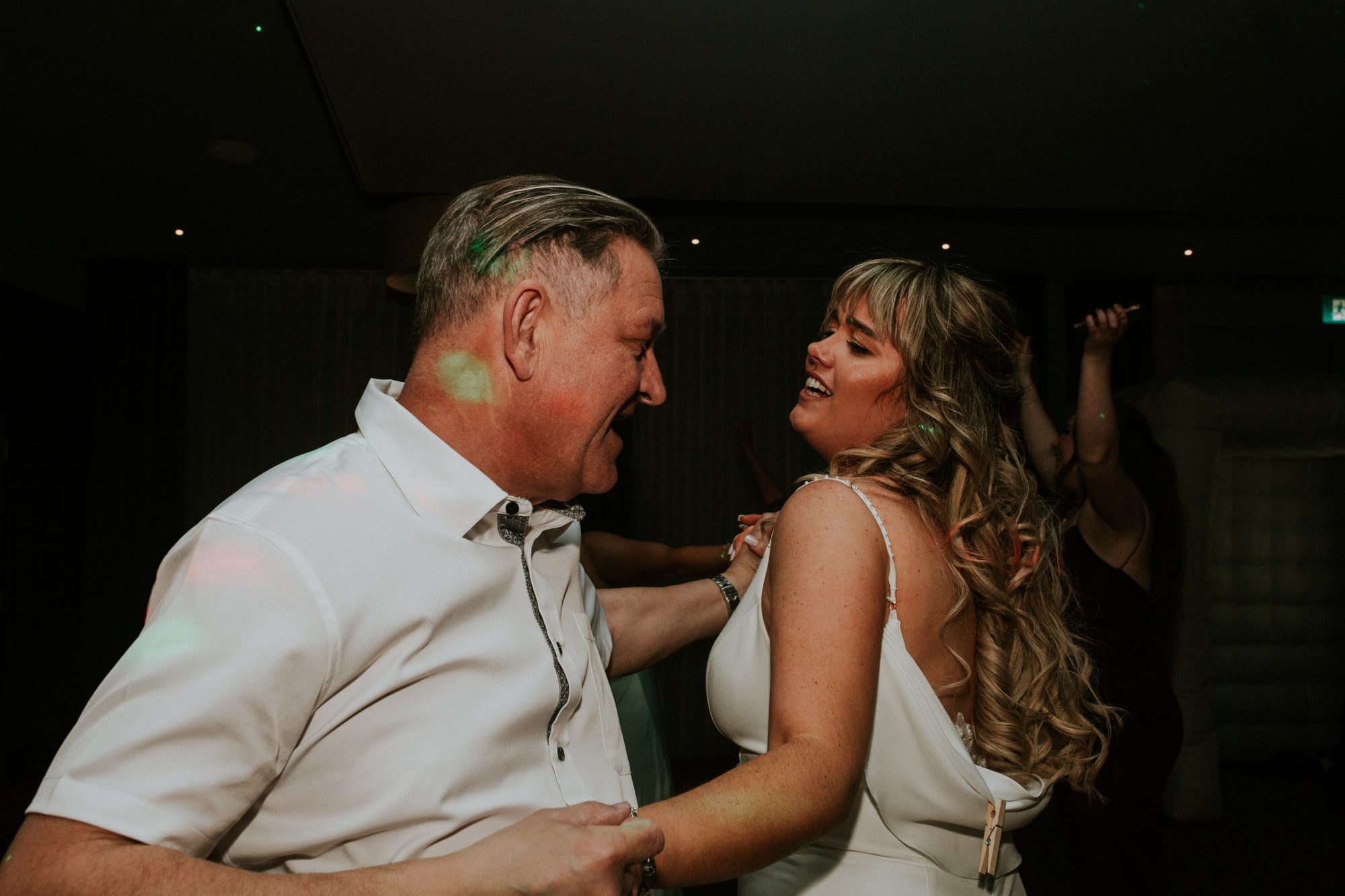 A bride and her father share a dance at their wedding reception at Above the Bay in Falmouth, Cornwall