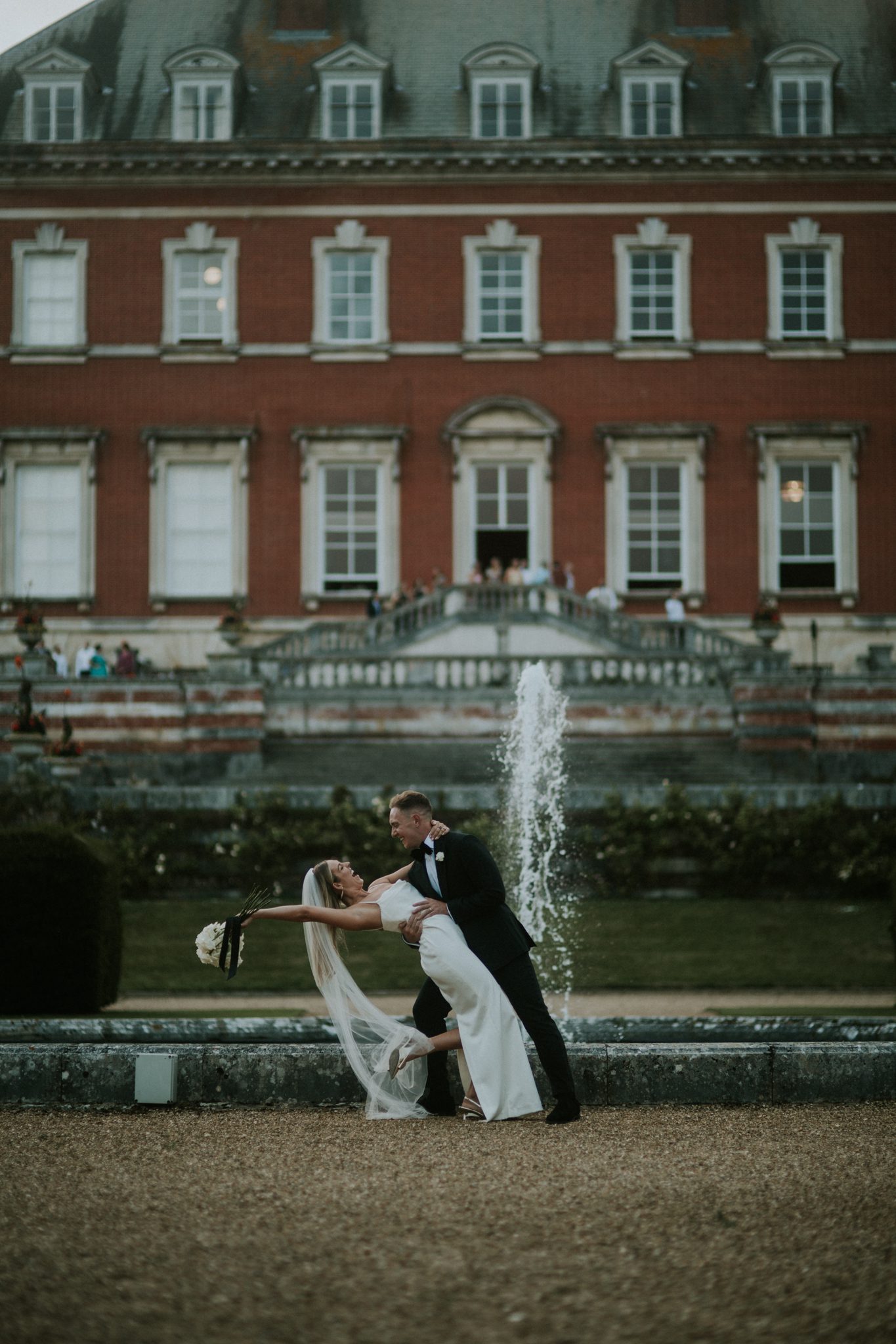 A newly married couple pose for photos after theirBryanston School wedding