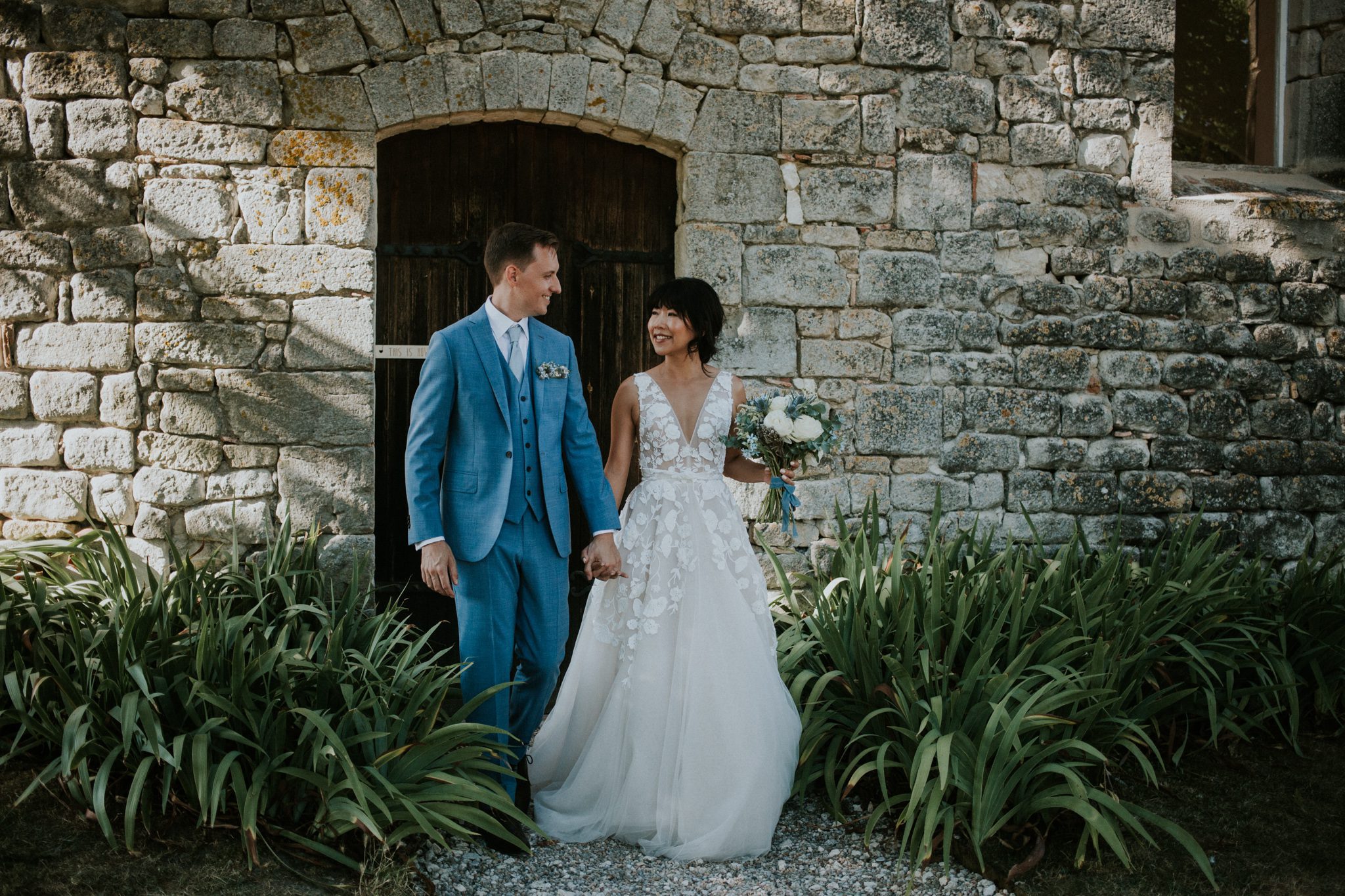 The bride and groom walk in the gardens at wedding venue Chateau St Paul, Marry Me In France