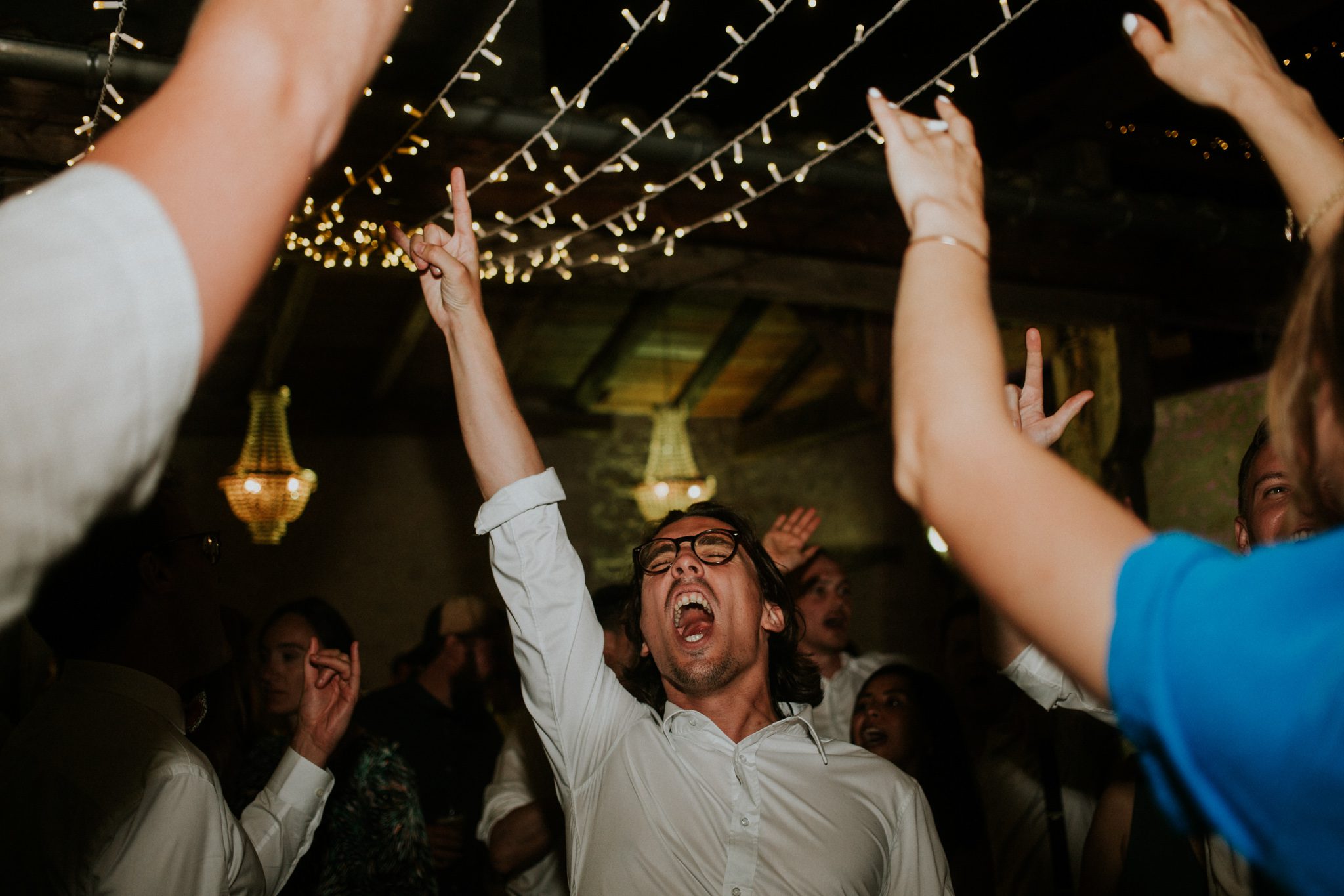 A reportage picture of a wedding guest on the dance floor at the wedding venue Chateau St Paul, Marry Me In France