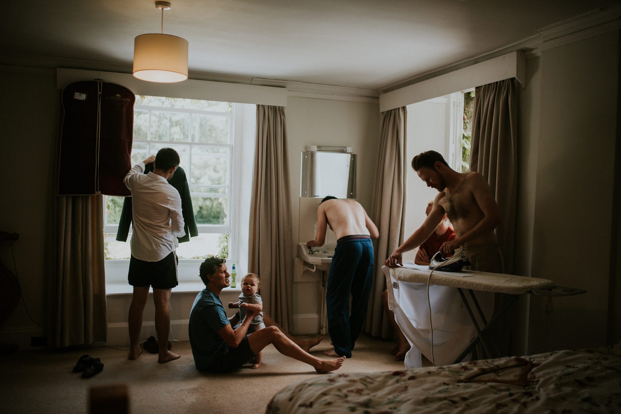 The men get ready before a wedding at Colehayes Park in Devon