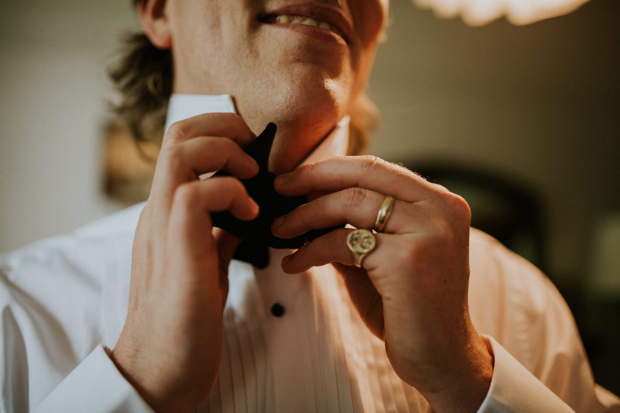 Men get ready in the morning of a wedding at The Lost Music Hall at Great Ambrook in Devon