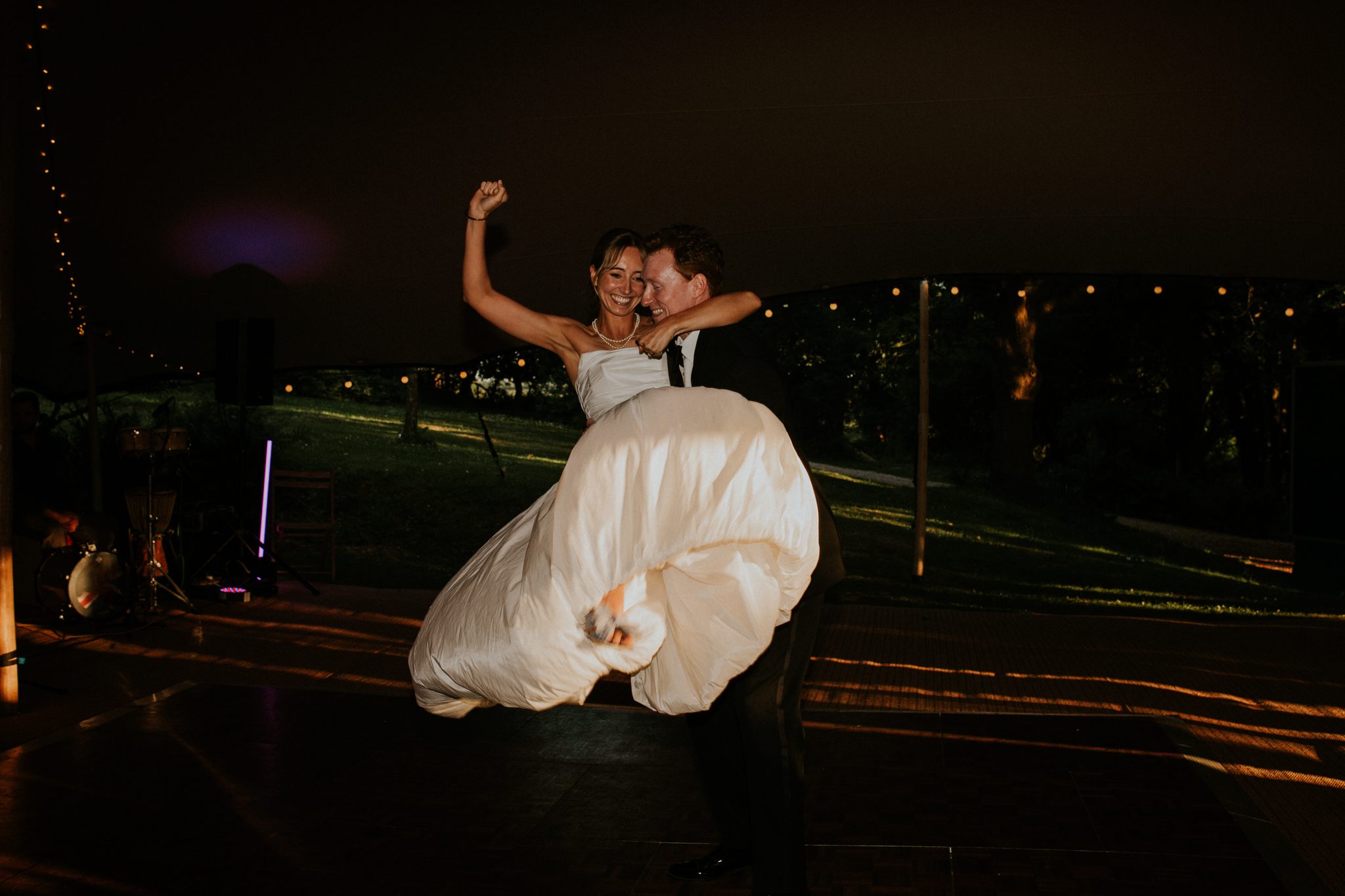 A bride and groom on the dancefloor during their wedding reception at The Lost Music Hall at Great Ambrook in Devon