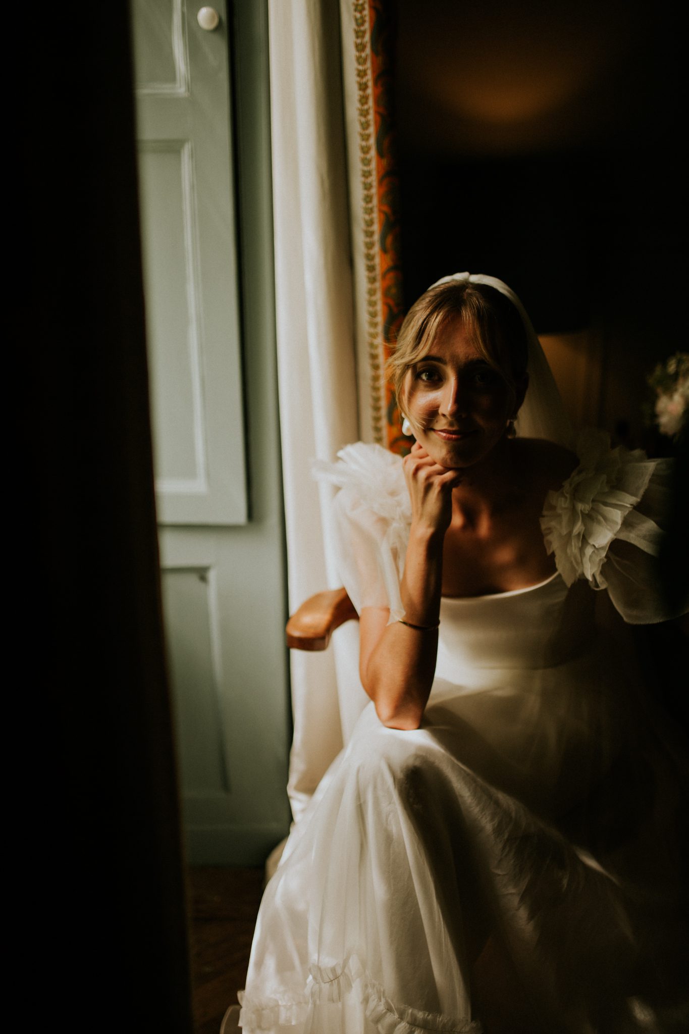 An editorial image of the bride taking a quite moment before her wedding at The Lost Music Hall at Great Ambrook in Devon