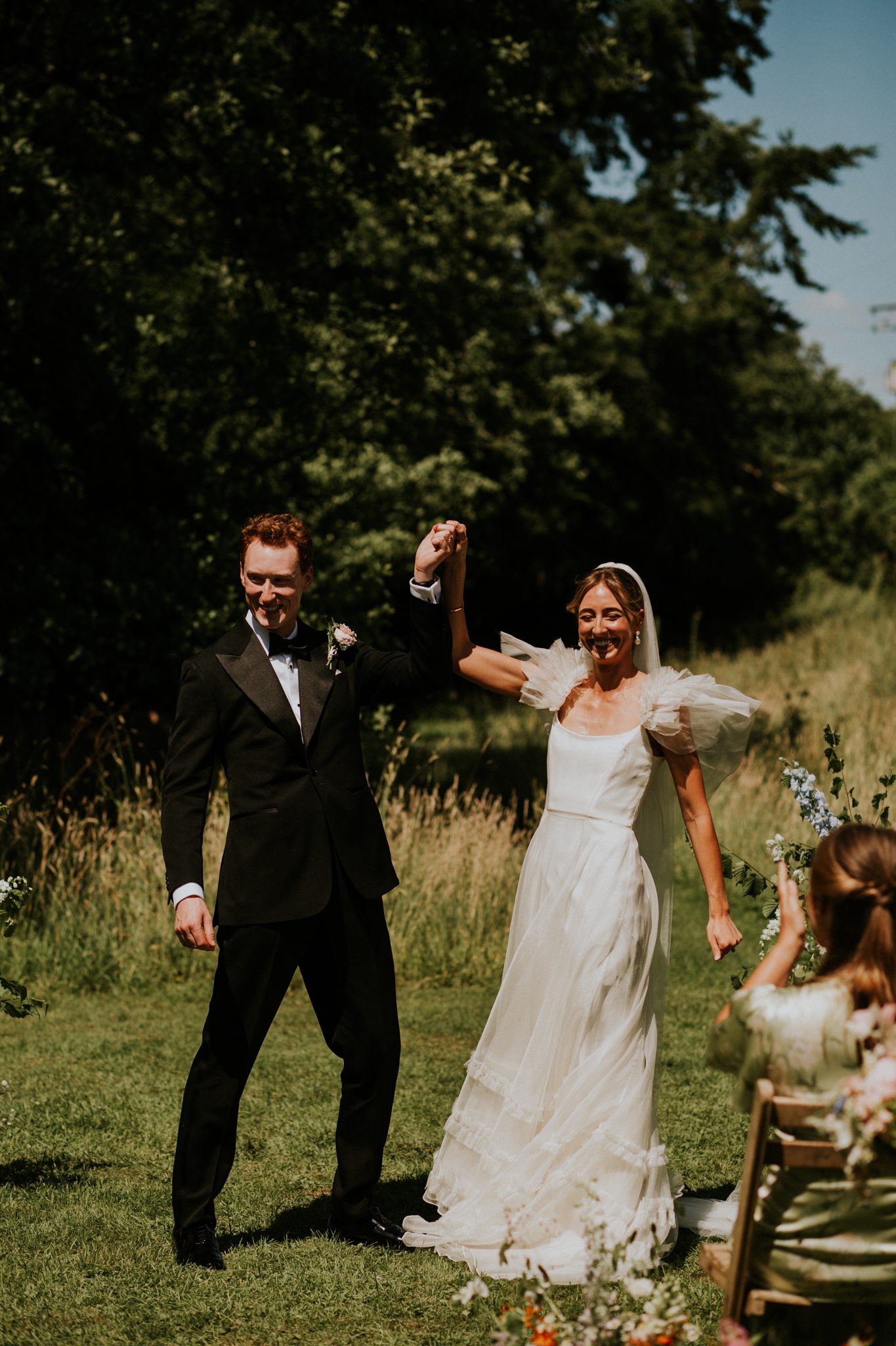 A bride and grrom enjoying that 'just married' feeling after their wedding at The Lost Music Hall at Great Ambrook in Devon